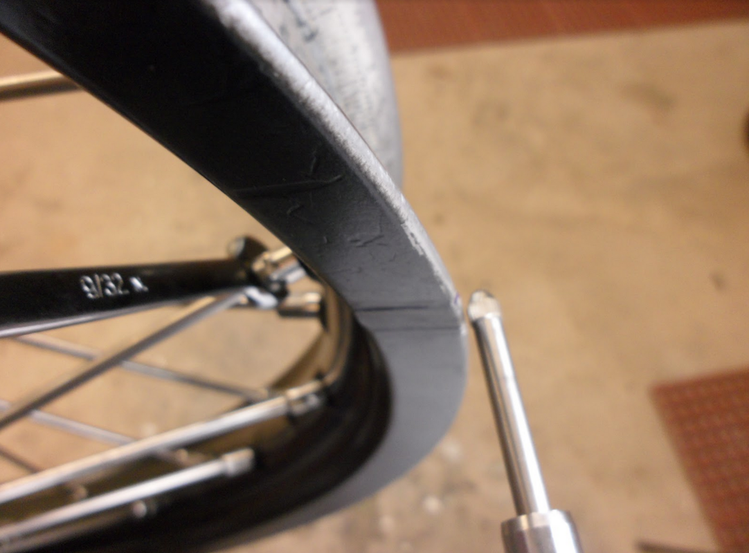 Example of checking runout on a dirt bike rim