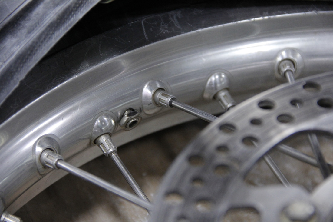 uickly install the valve stem nut before it recedes back into the tire cavity