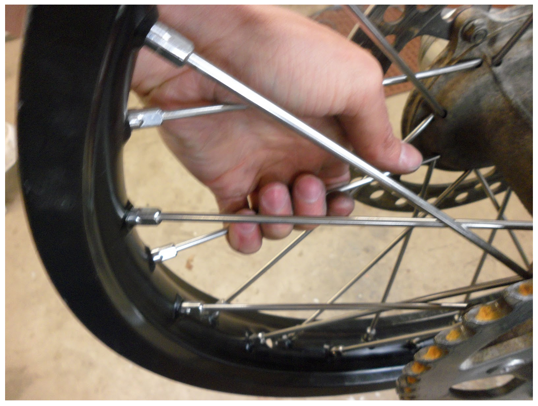 Squeezing the spokes to check them