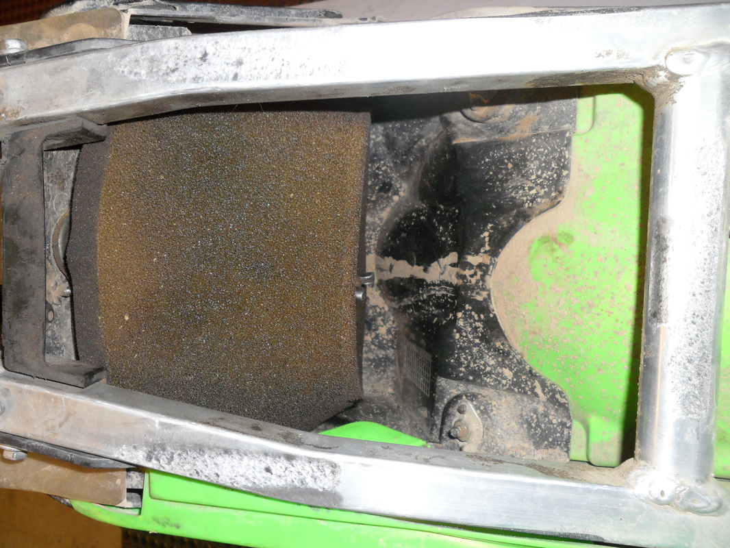 example of a dirty air filter on a dirt bike